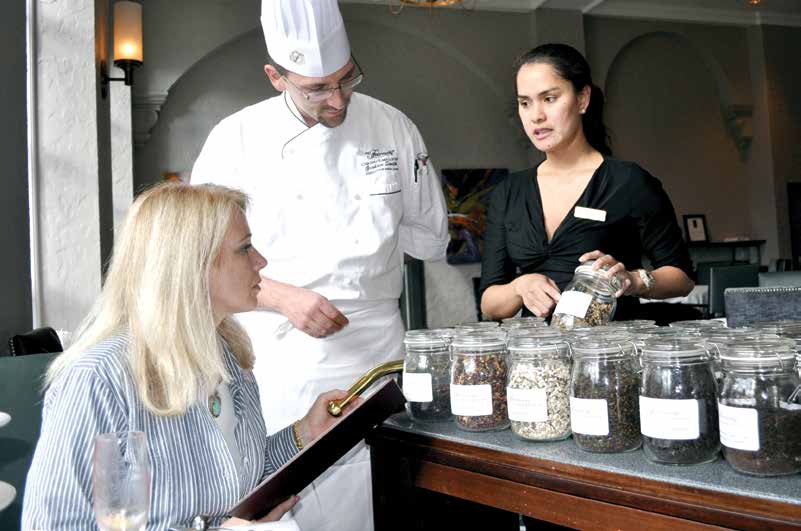Graham Smith, executive sous chef, and Sophia Marie Crisol, tea sommelier, explaining the varieties and blends.