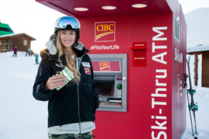 World Champion & Olympic Gold Medalist Ashley McIvor experiences banking at her ski tips with CIBCs new ski-thru ATM at the top of Whistler Mountain at Whistler Blackcomb Ski Resort. (CNW Group/CIBC)